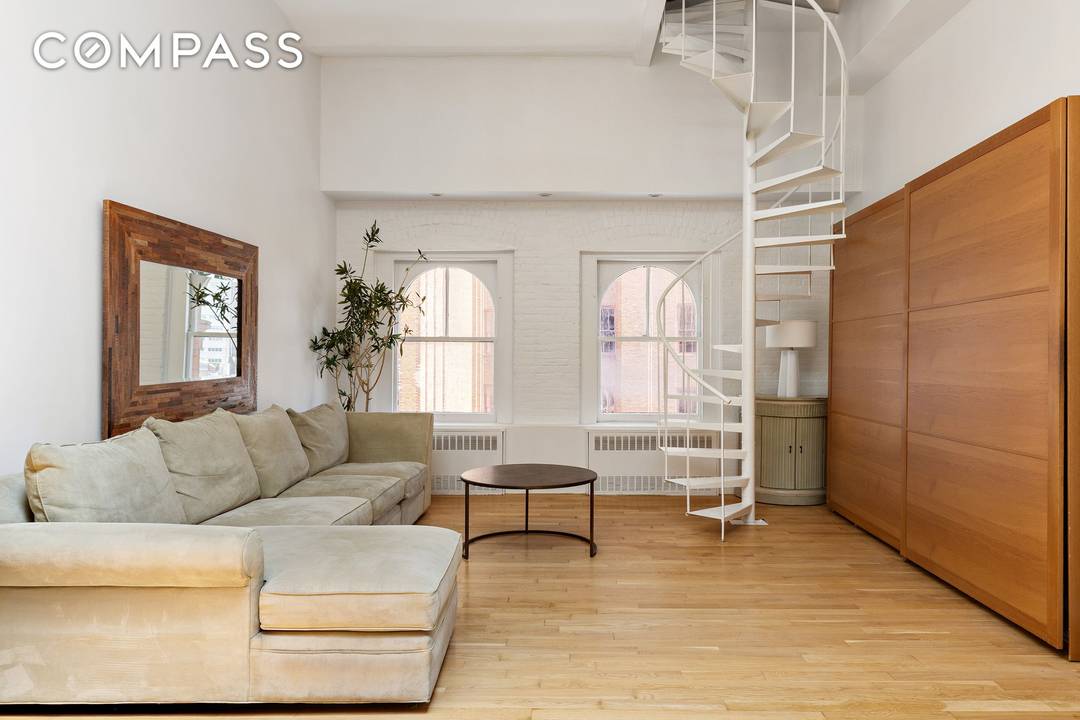 Tribeca Loft Triplex with Private Rooftop Oasis This true Tribeca loft blends historic charm with rare outdoor living across multiple levels.