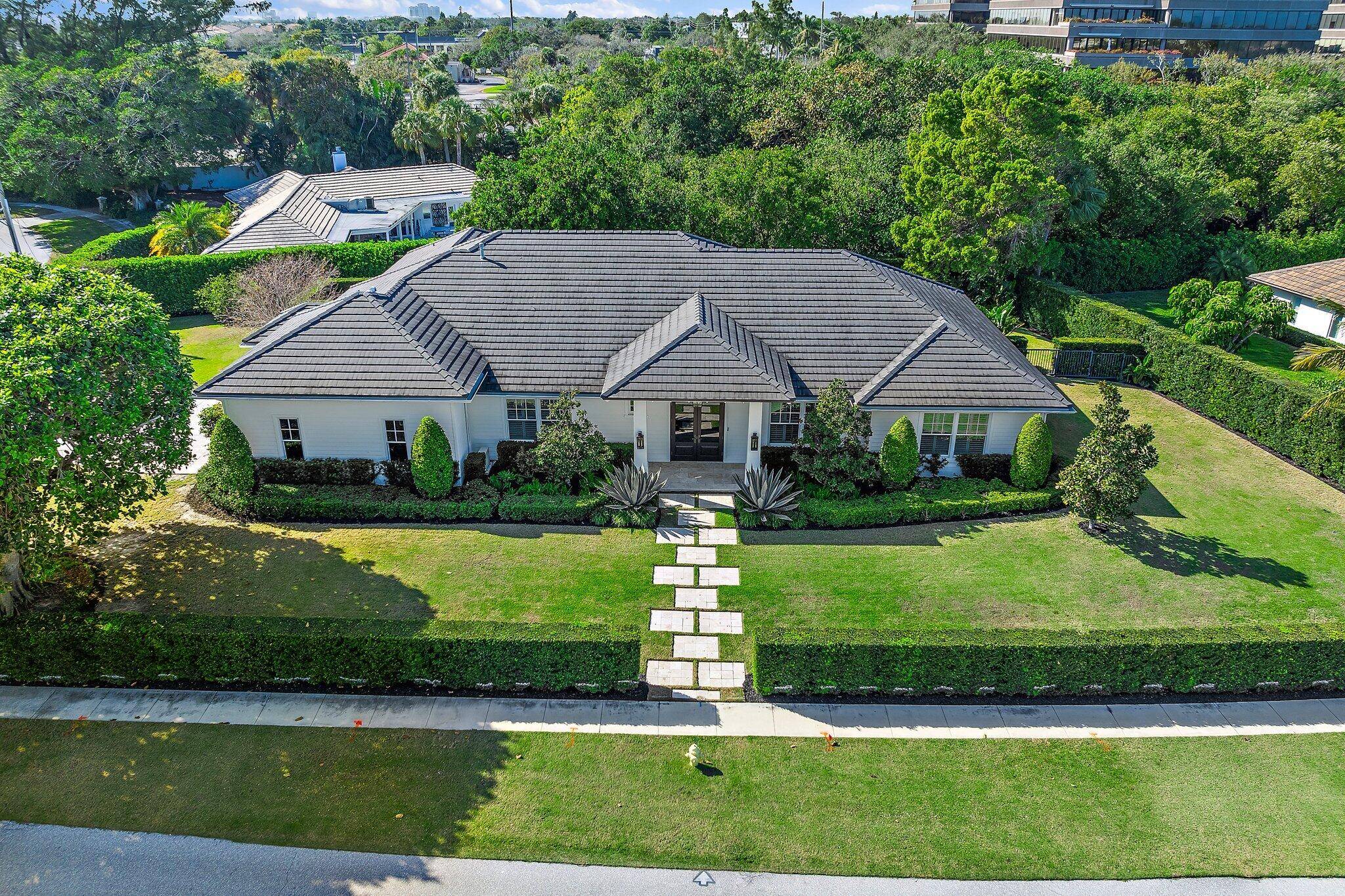 EXQUISITE modern coastal home, built in 2017, exemplifies the highest quality construction classic Florida design.