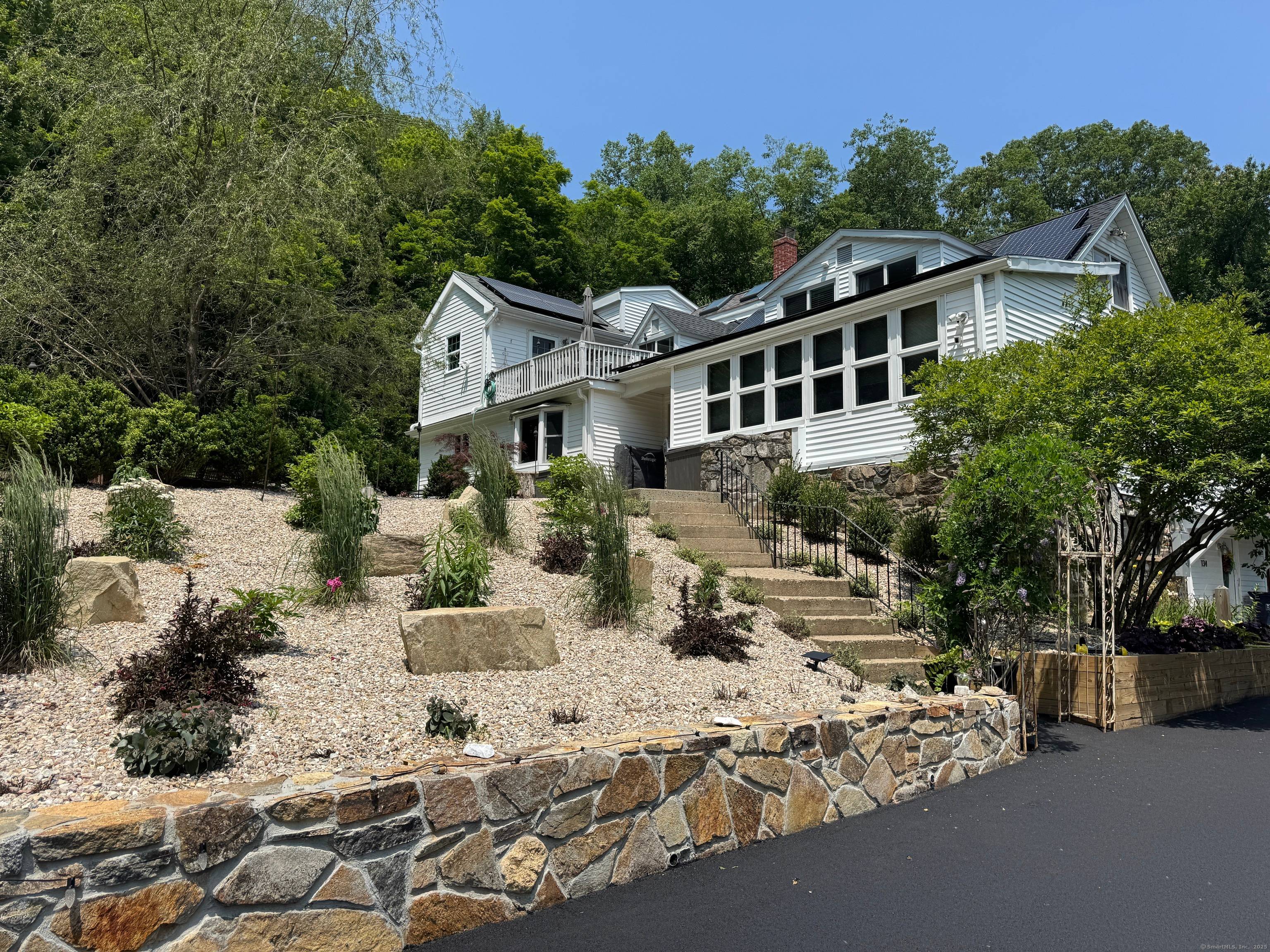 Welcome to this beautifully updated Cape Cod Colonial nestled on over 18 acres, with an additional 1.