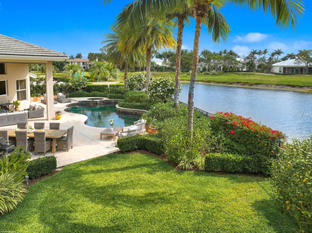 Spectacular lake and preserve views from one of the largest lots within the Shady Oaks neighborhood of Palm Beach Polo.