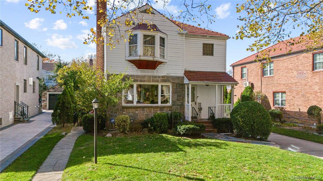 NEW PRICE IMPROVEMENT Discover your dream retreat on one of Hollis Hills most desirable tree lined streets, nestled among beautiful new construction homes.