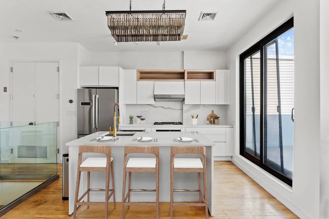 Outstanding and rare Greenpoint triplex condo offering expansive layout, refined finishes, and exceptional outdoor space.