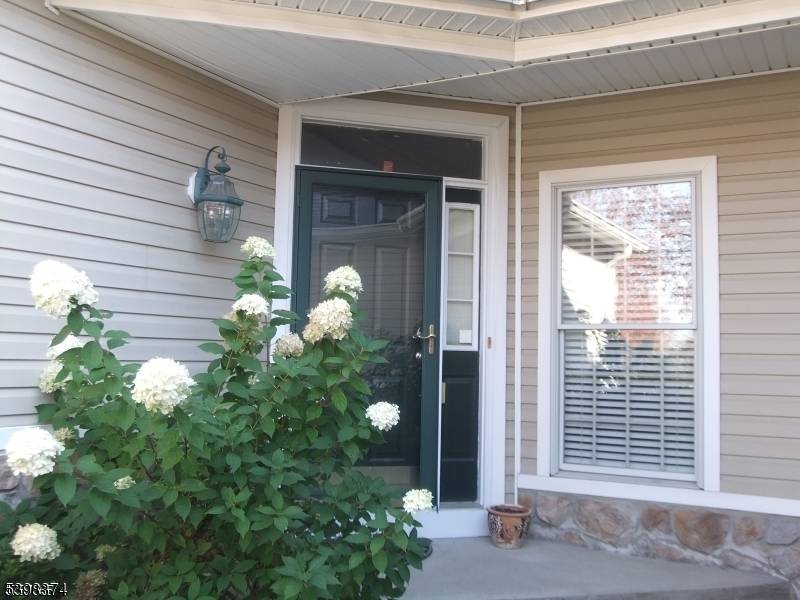 Welcome to this beautifully refreshed, west facing Brookline model townhome nestled within a prestigious gated community.