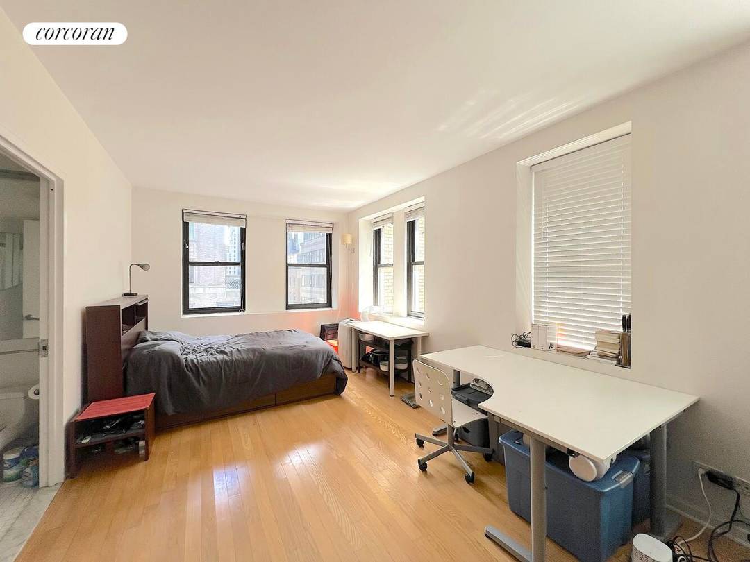 Sun Drenched Corner Studio with Historic Charm Welcome to Apartment 15B at 56 Pine Street a beautifully appointed corner studio offering an abundance of natural light and classic New York ...