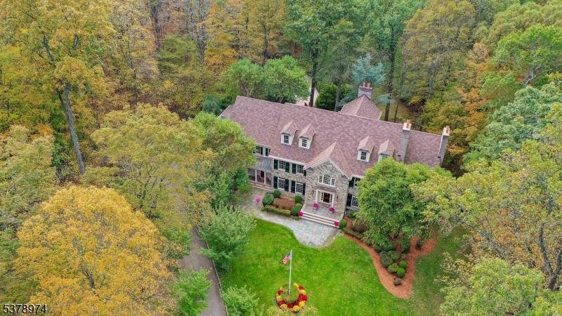 Nestled on over 7 acres in a tranquil cul de sac, this exquisite Bernardsville estate blends timeless elegance with modern luxury and exceptional craftsmanship.