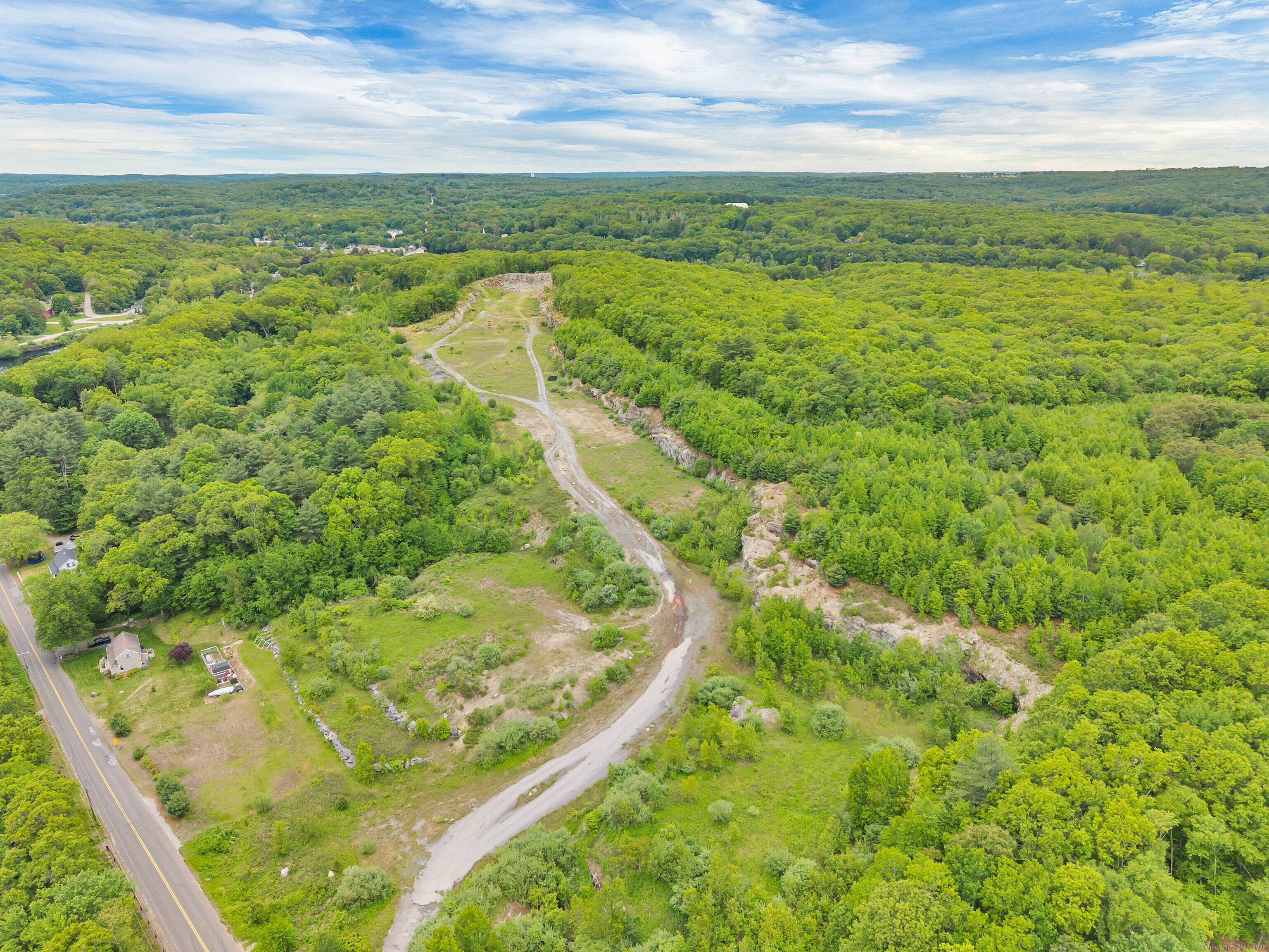 This potential 70 acre development in Sprague, Connecticut, offers a unique opportunity to build a 96 unit condominium community with two small retail centers in the town's Village Design District.