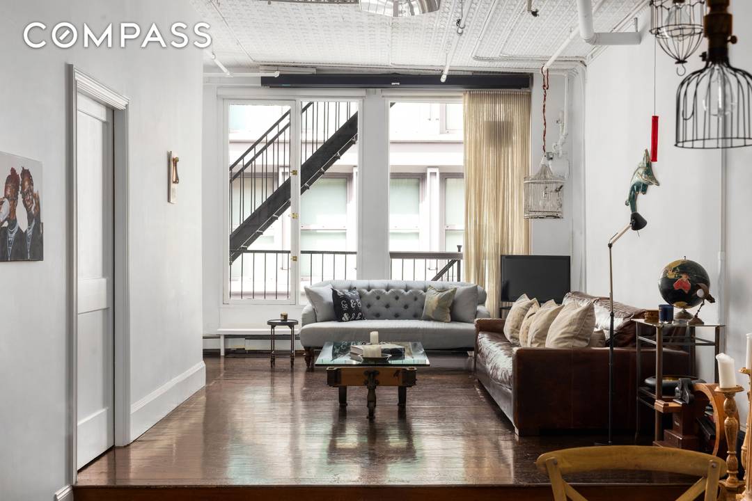 Welcome to this authentic cast iron SoHo loft Condominium, offering two bedrooms, a den, and one and a half bathrooms.