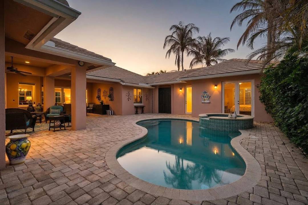 Experience island living with private beach access in this immaculate 4BR 4BA West Indies style courtyard pool home in Bermuda Club offering 3, 150 sq ft.