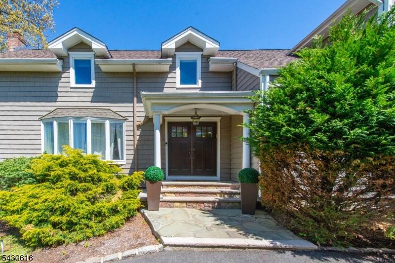 Gracefully positioned with Sunset Views this CLASSY TIMELESS Colonial boasts a COVETED GRAND FOYER.