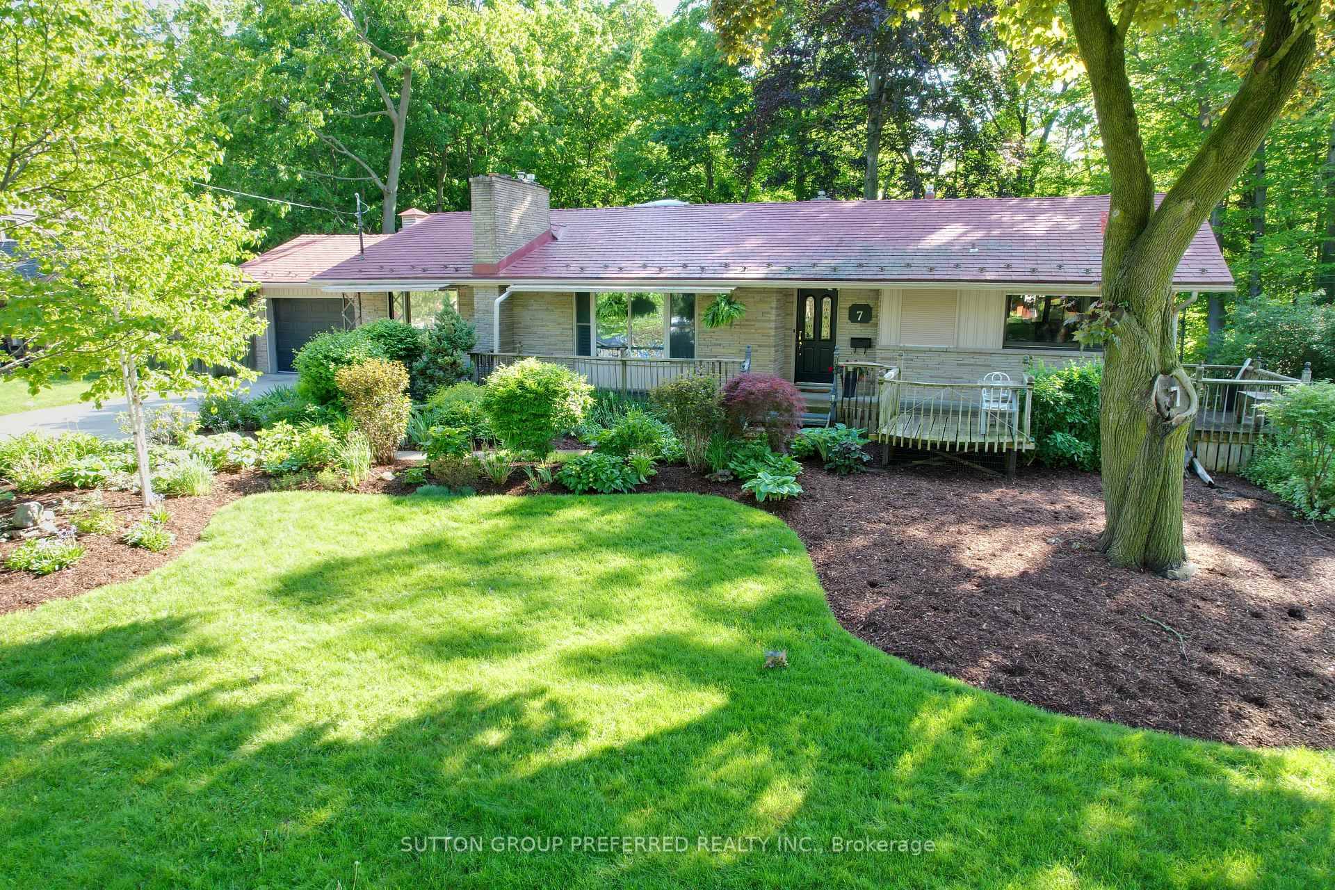 Nestled among mature trees in the sought after Orchard Park neighbourhood, this stone faced home combines country charm with modern living.