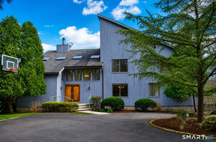 Experience refined living in this exceptional contemporary residence, privately set on 1.