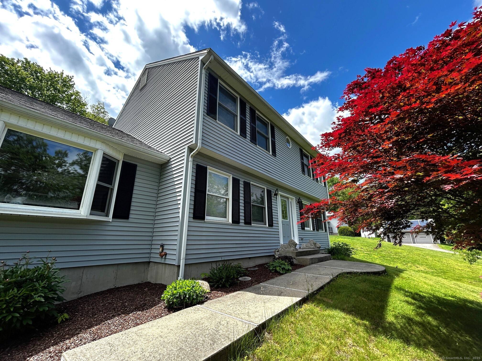 Welcome to this spacious and beautifully maintained traditional Colonial home on a 1.