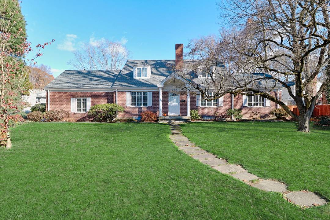 Welcome to this classic and charming brick Cape Cod, a warm and inviting home.