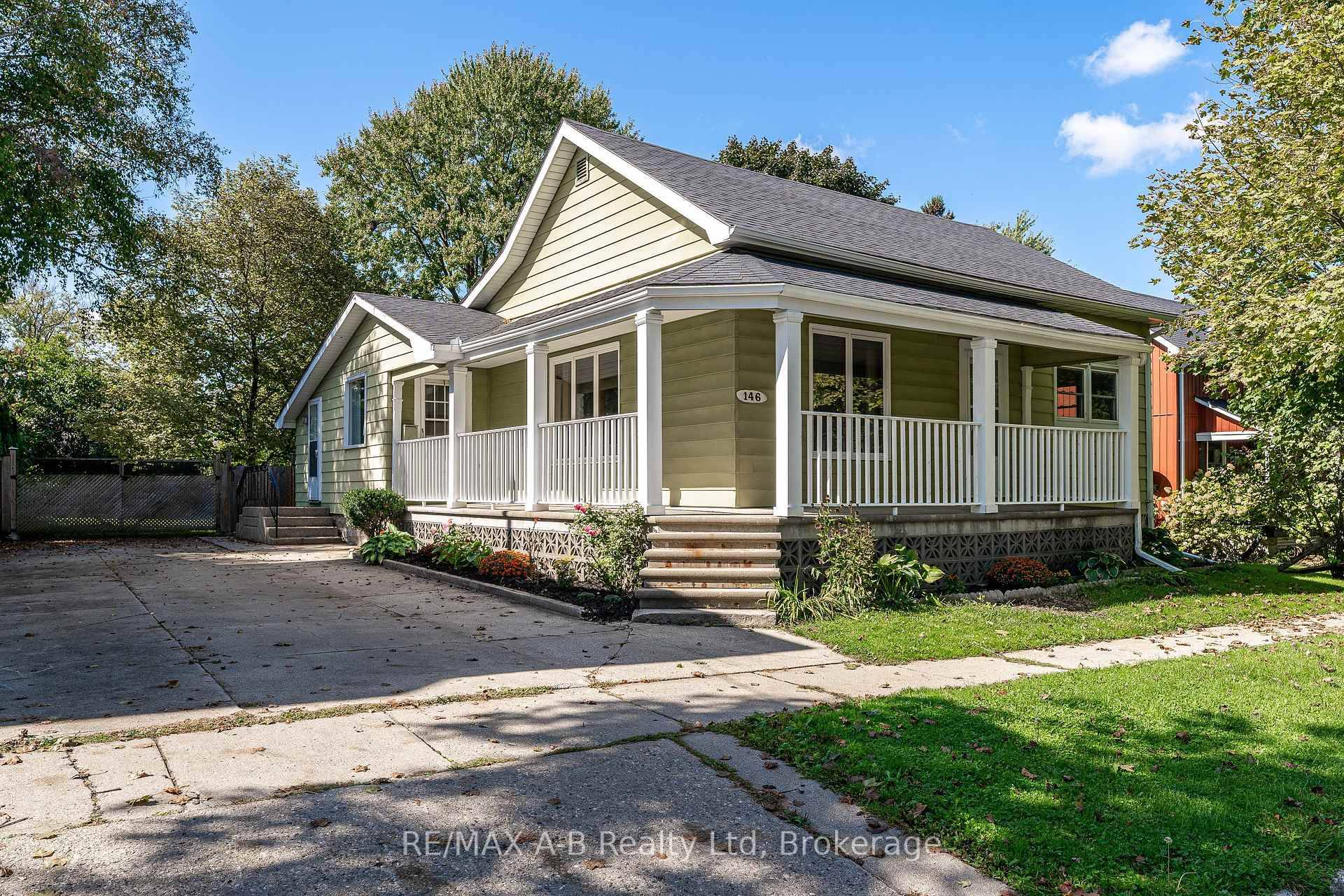 This updated, move in ready bungalow is set on a generous 66' x 150' lot and features a charming wrap around porch, ideal for enjoying the peaceful surroundings.