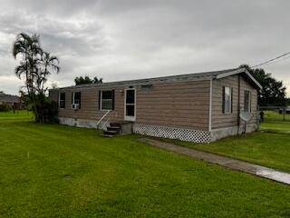 This is a Mobile Home located on a 1 2 acre lot.