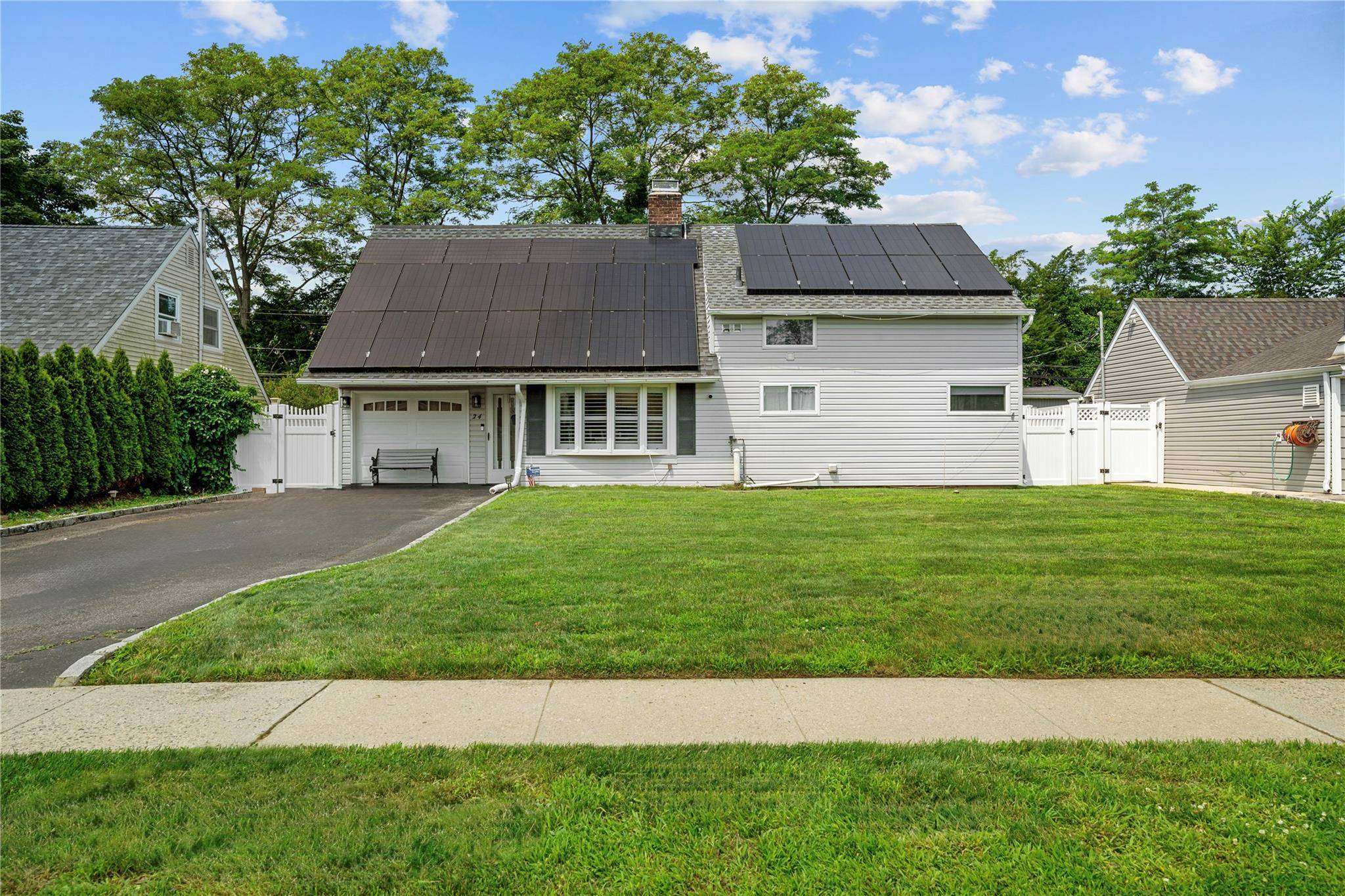 Welcome to a move in ready 4 bedroom 2 bath beautifully maintained, spacious Cape in the heart on Levittown.