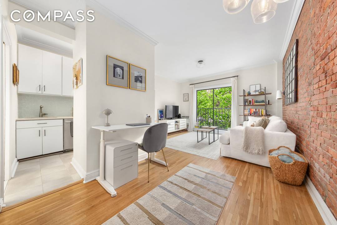 Welcome home to this south facing one bedroom residence featuring high ceilings, a Juliet balcony, hardwood floors, crown moldings, excellent closet space, and exposed brick.