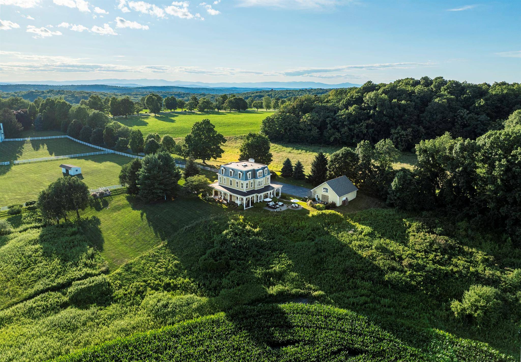 This architecturally distinctive Millbrook home was authentically built in the Second Empire Victorian period style in 1994.