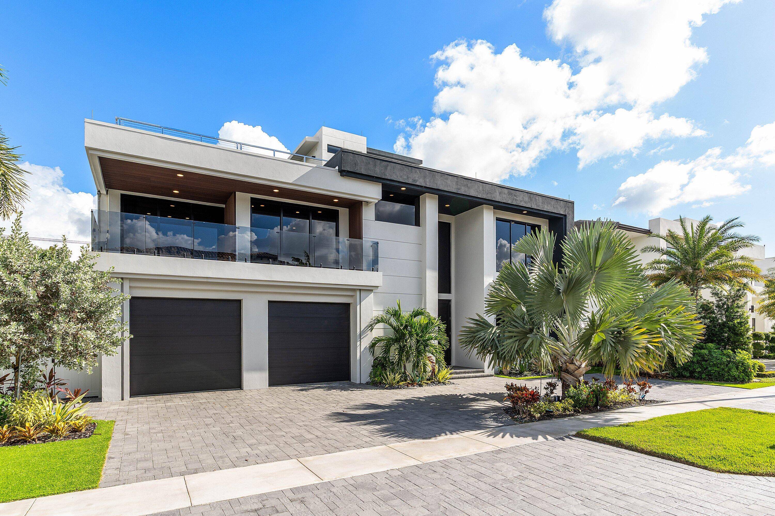 Built in 2023 by Primo Construction, this striking three story modern estate in Boca Villas offers 6 bedrooms, office, 6.