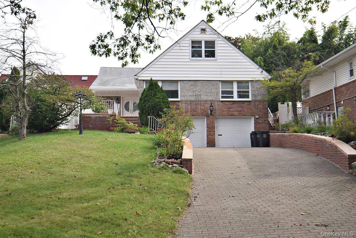 Welcome to this completely renovated colonial in the heart of Holliswood a neighborhood known for its prestigious charm and convenience.