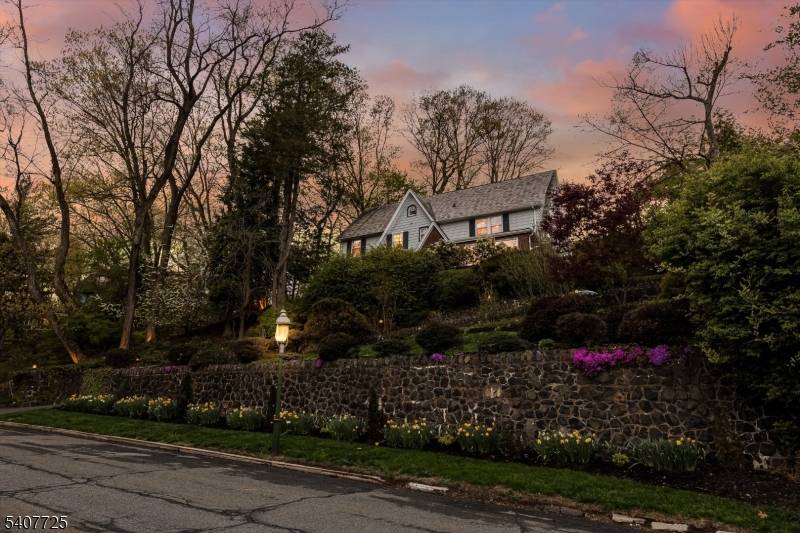Perched high among the trees with sweeping, unobstructed views of the NYC skyline, this five bedroom, three full and two half bath home is a rare and breathtaking retreat.