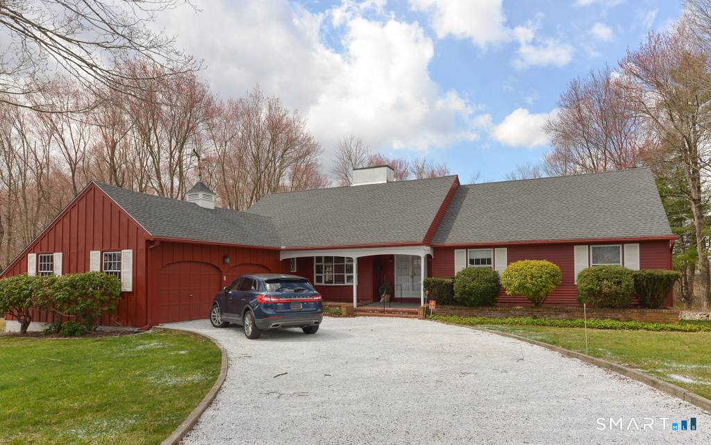 An incredible opportunity awaits near the end of a cul de sac overlooking the Country Club of Waterbury.