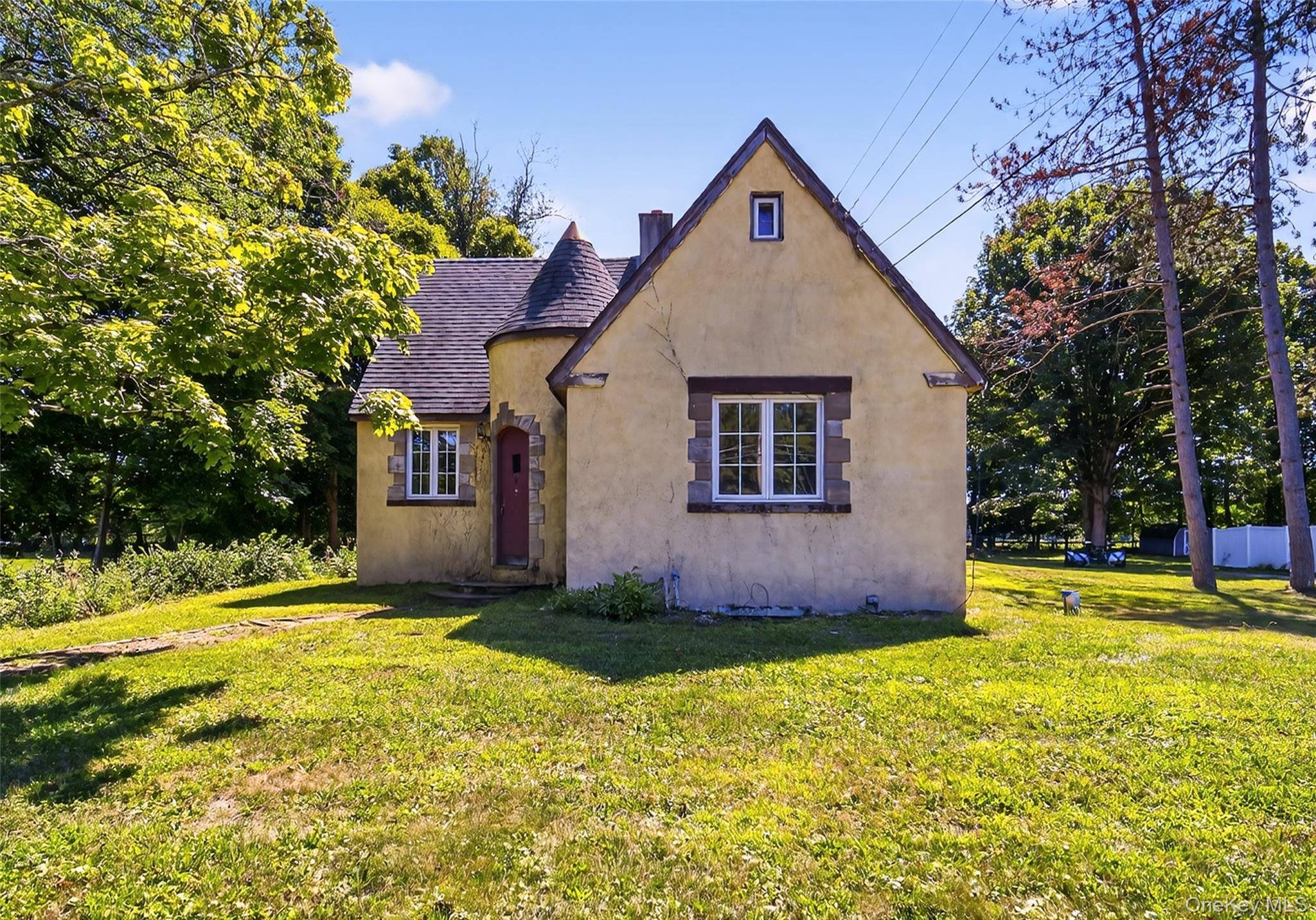 Bring your imagination to this 4 bedroom, 2 full bath Cape Cod nestled on a quiet, peaceful lot just over half an acre.