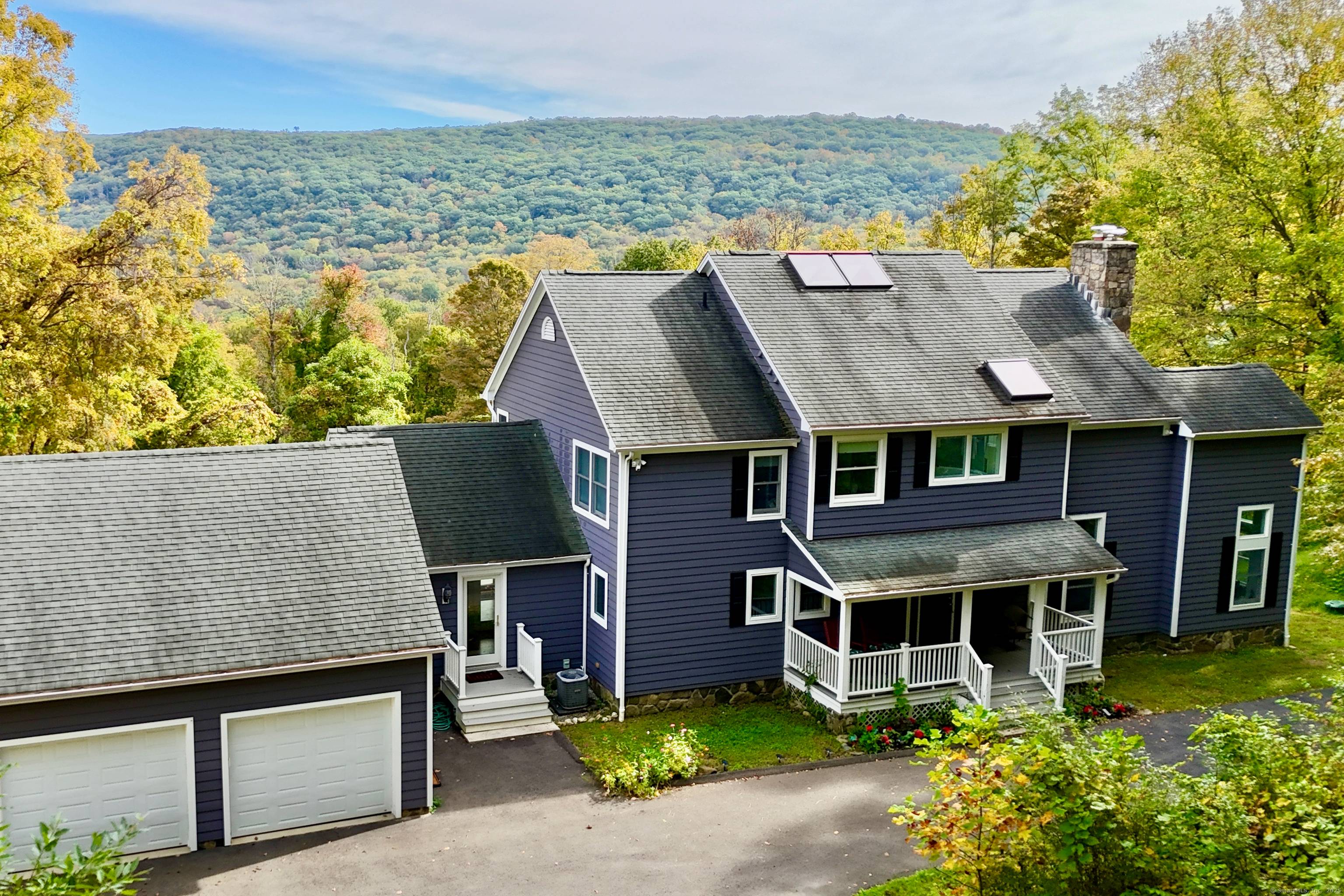 Escape to this mountaintop retreat with sweeping, unobstructed views located off one of the most desirable scenic roads in the Litchfield Hills.