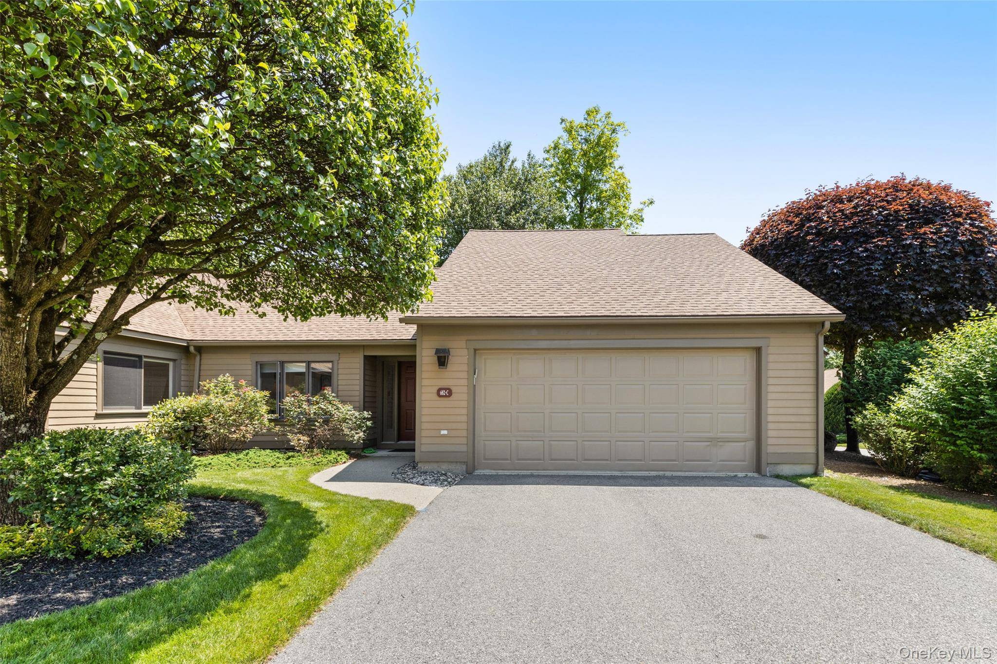 Beautiful Sherman II one level, end unit with 2 car garage.