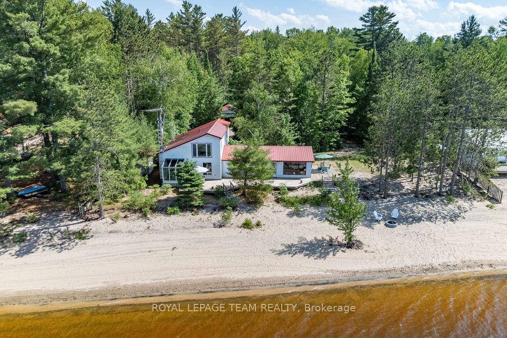 Welcome to 171 Branch Trail, affectionately known as Sandridge, an exceptional waterfront property nestled on one of Canadas finest sand beaches.