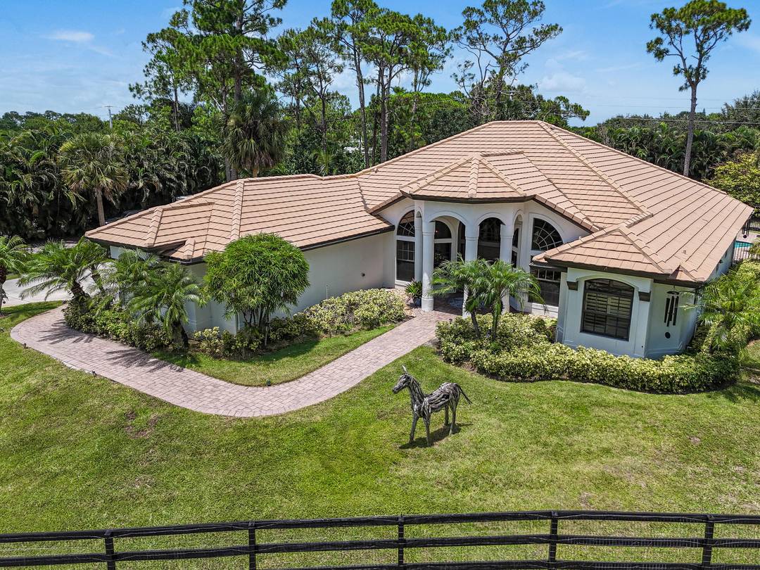 This remarkable 4 3 with den office pool home is situated on 2 private acres.