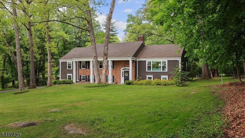 Nestled on over an acre in one of Bernardsville's most sought after neighborhoods, this stunning fully renovated custom home offers the perfect blend of style, comfort, and convenience.