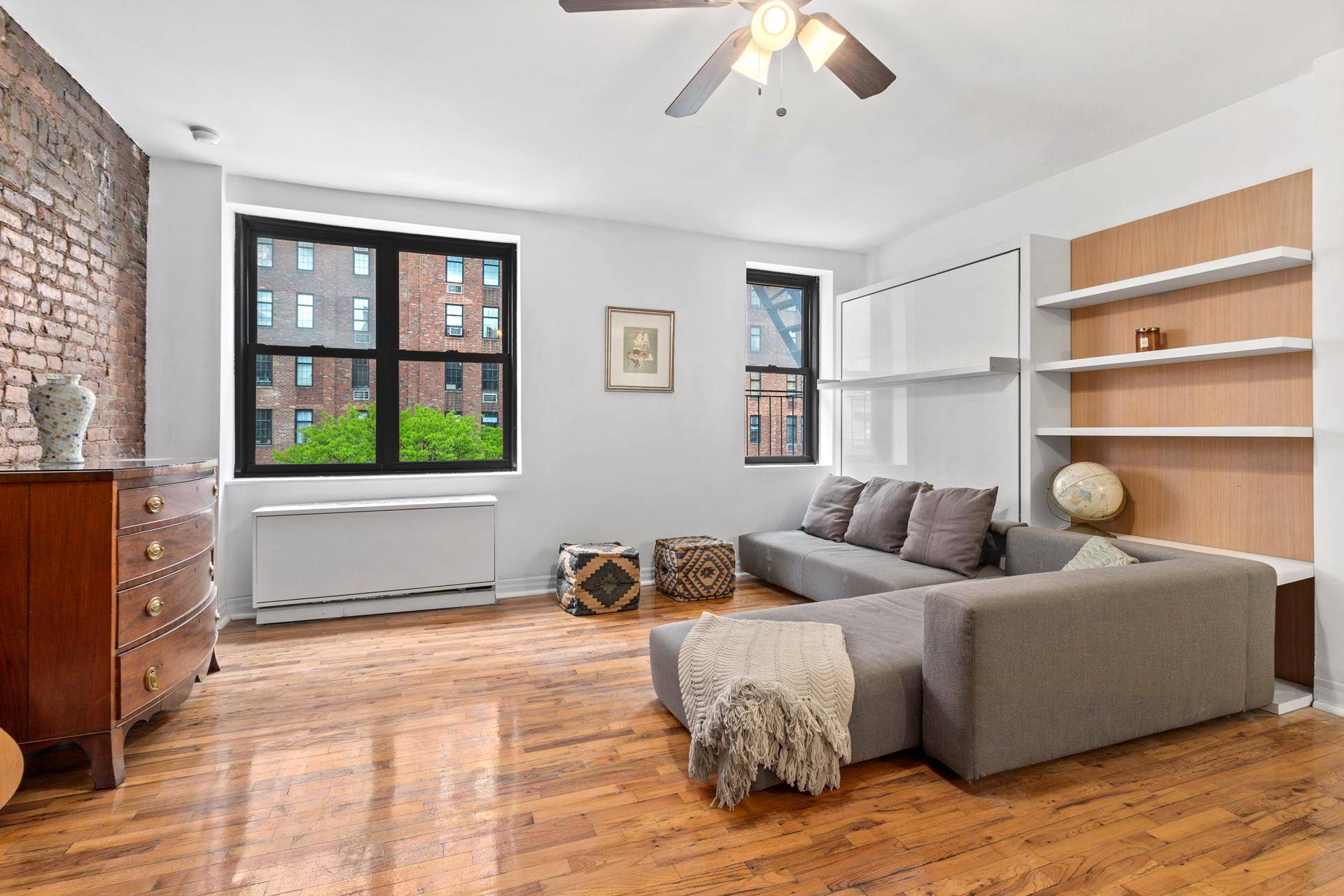 This large and sunny studio co op apartment is perfectly set on a beautiful tree lined street in the heart of Chelsea.
