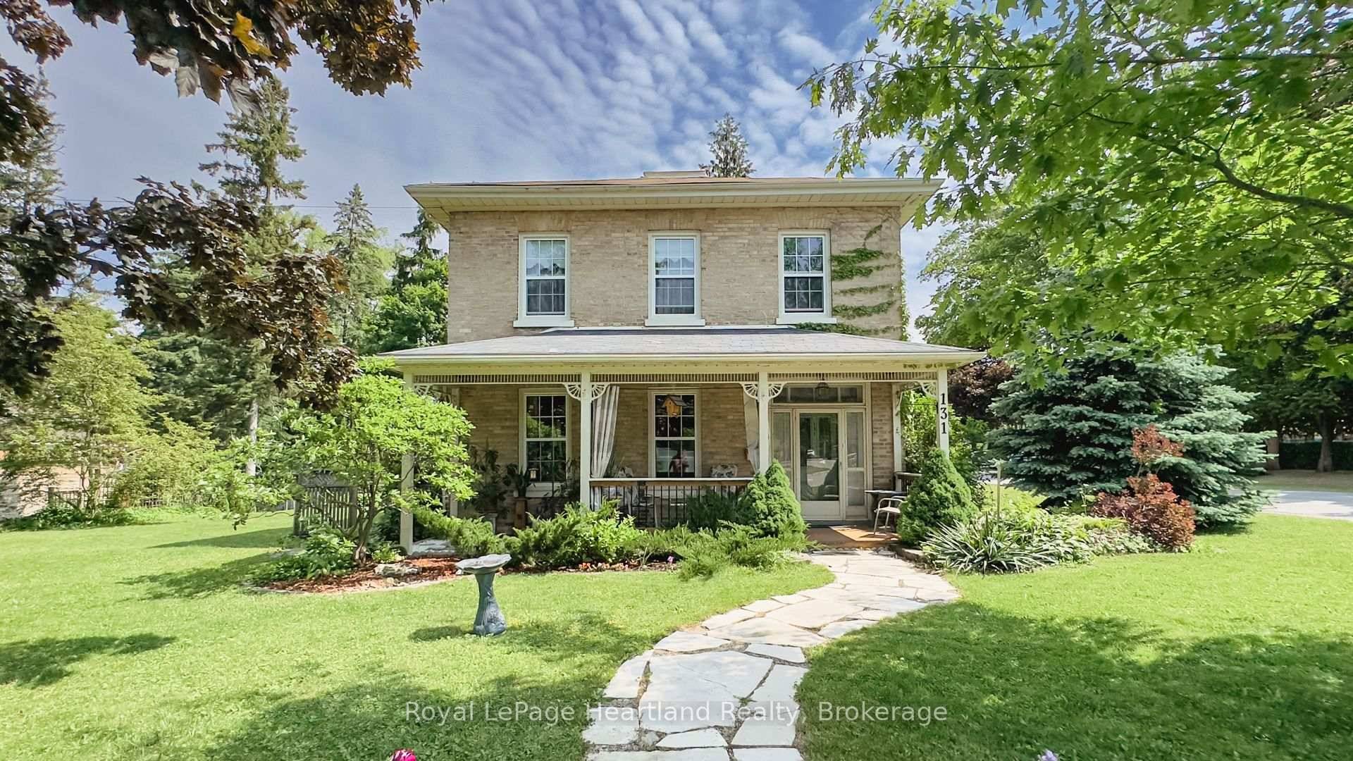 Timeless Yellow Brick Century Home on a Corner Lot Full of Charm, Character, and Curb Appeal !