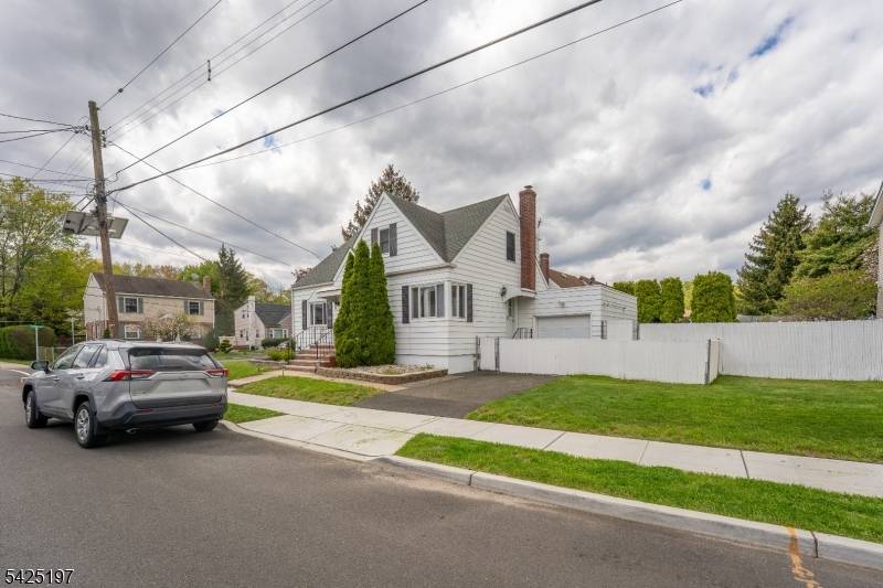 Perched on a spacious corner lot, this move in ready Cape Cod is brimming with vintage charm.