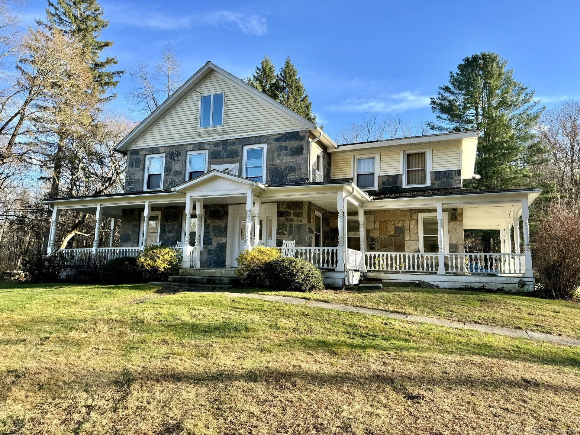 Potential awaits at this stunning antique stone home.