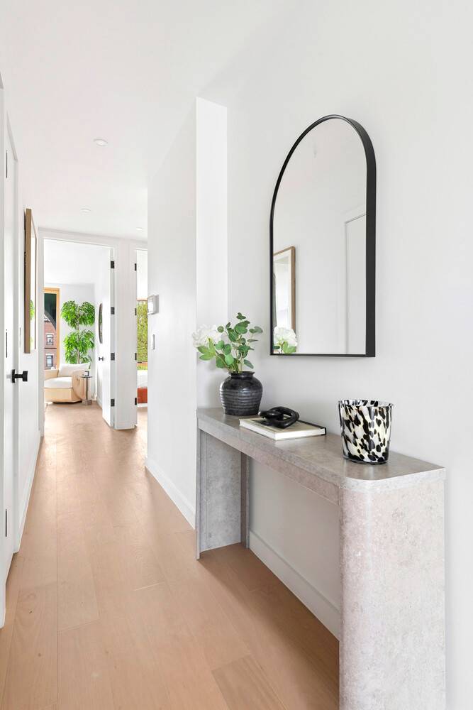 Crowning 19 North Henry Street, a floor through penthouse duplex offering a rare level of privacy, scale, and indoor outdoor lifestyle.