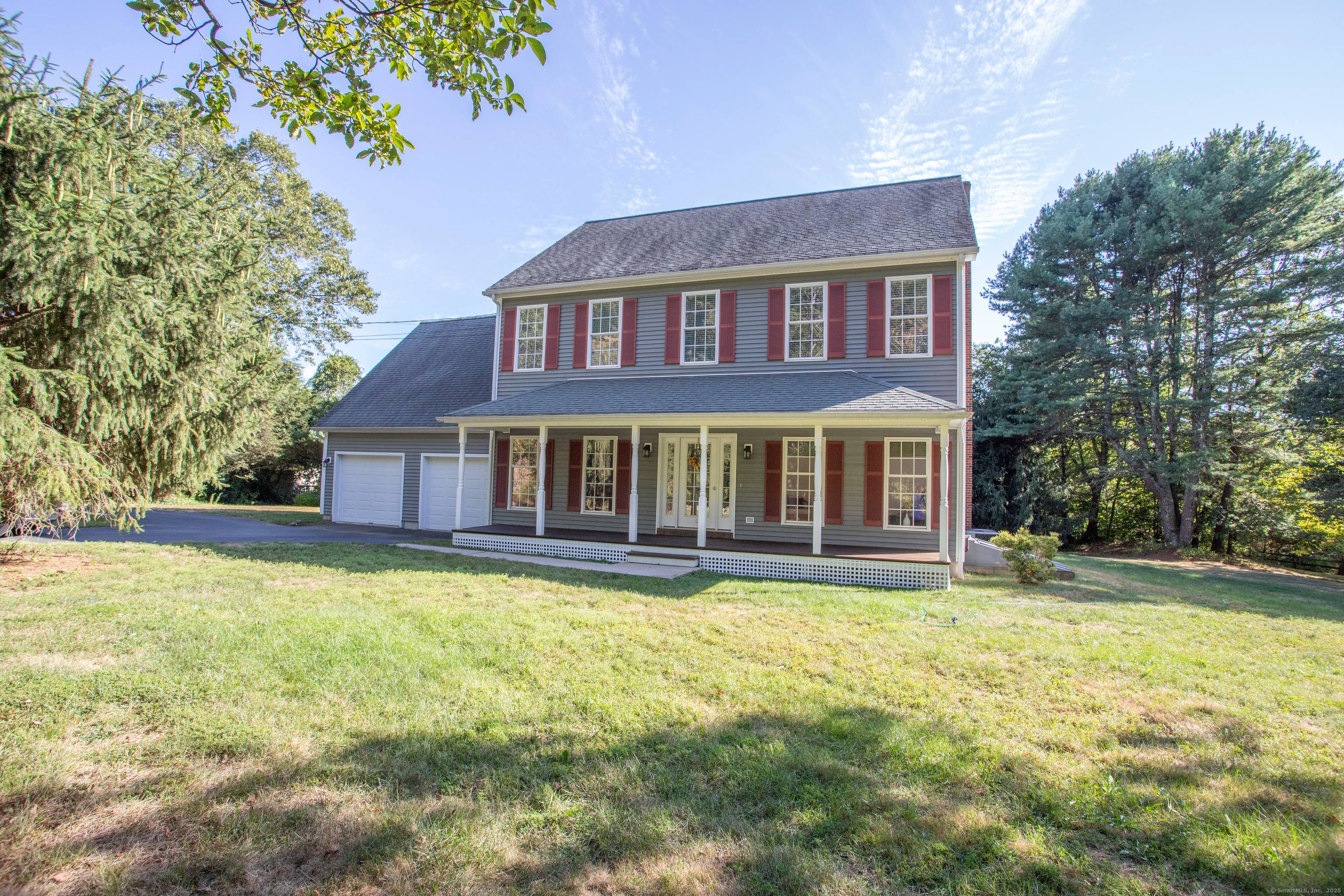 Welcome to this beautifully maintained Colonial that feels nearly new, offering an open kitchen into living room layout that is ideal for modern living and entertaining.