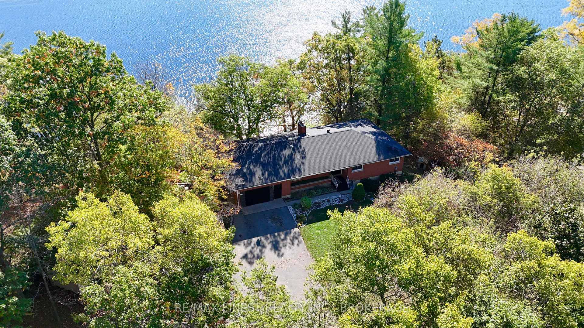 STUNNING ! ! This beautiful hilltop bungalow overlooking Rock Lake on a gorgeous 1 acre lot features 3bedrooms, 1 and a half bathrooms, kitchen, separate dining and office on the ...