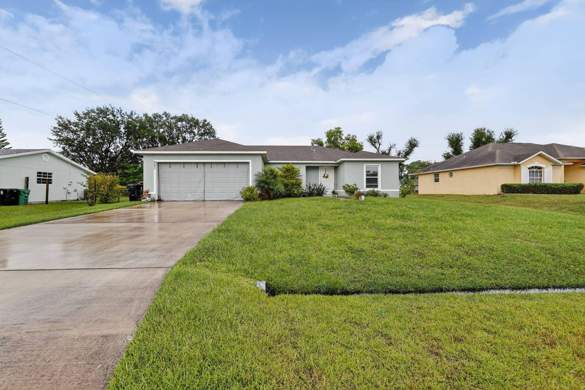 Welcome to this inviting 3 bedroom, 2 bathroom home with a spacious 2 car garage in the heart of Port St.
