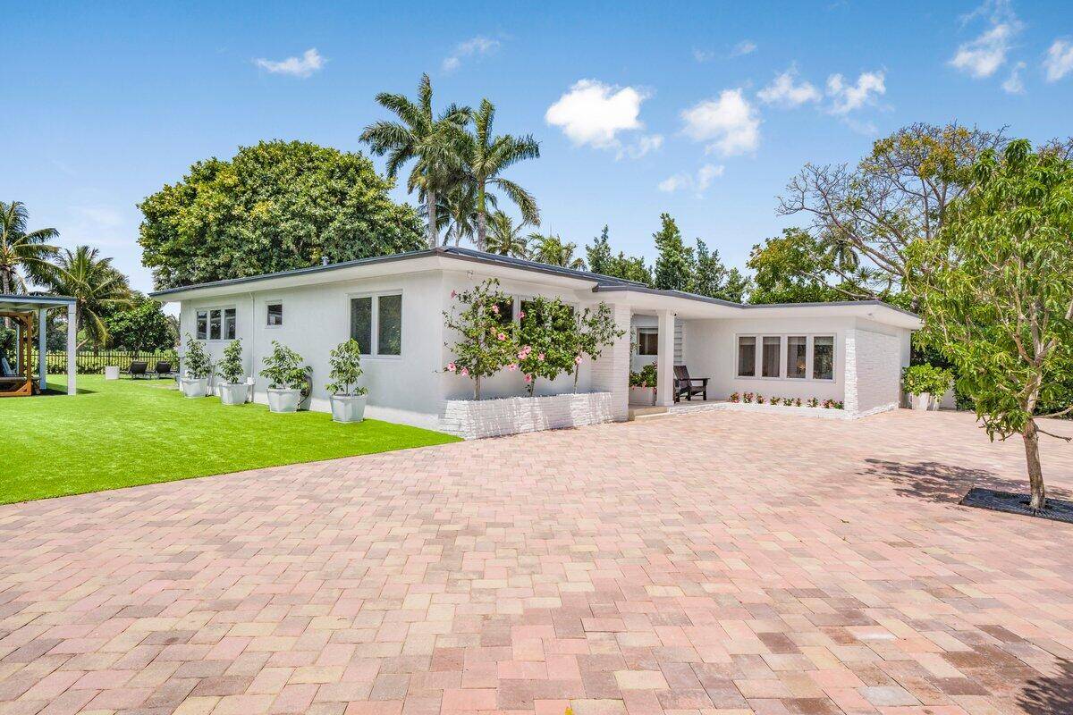 Fully reimagined with 400K in upgrades, this La Gorce estate offers luxury living with stunning views of the iconic La Gorce golf course !