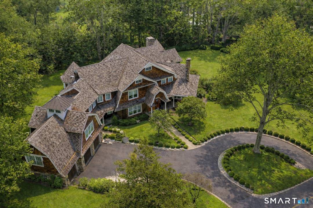 Set in a coveted estate enclave prized by CEOs and captains of industry, this exceptional, shingle style residence embodies timeless architecture, extraordinary craftsmanship, and meticulous attention to detail.