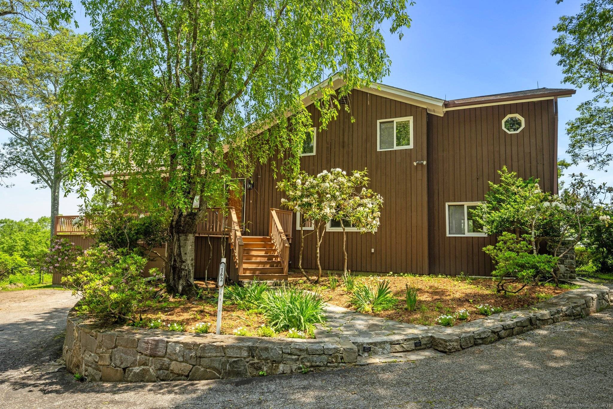 Luxury Retreat with Panoramic Water Mountain Views New Fairfield, Connecticut 16 Secluded Acres Candlewood Lake Squantz Pond Perched high above the treetops with mile high, million dollar views, this extraordinary ...