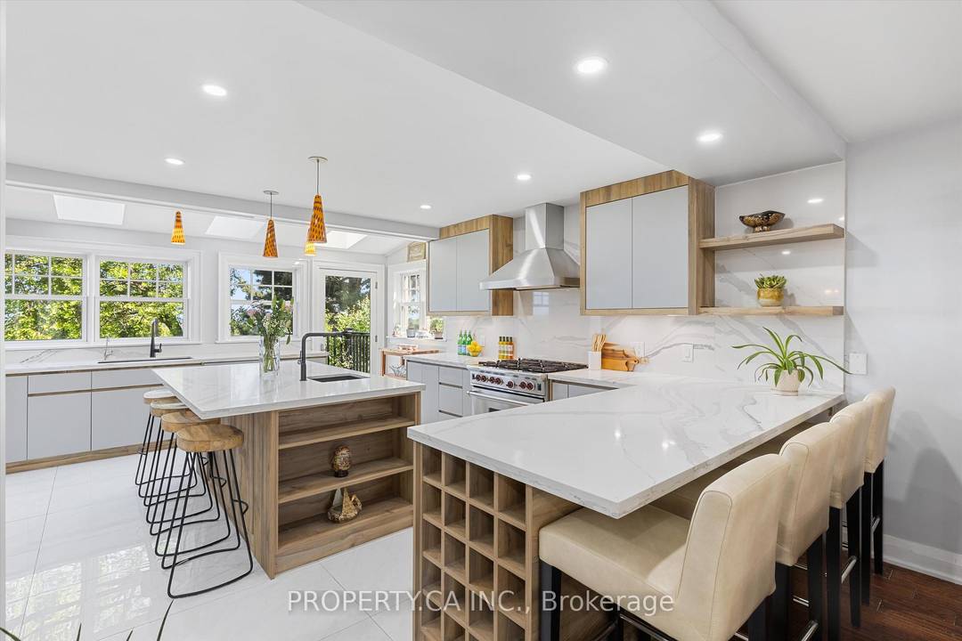 Welcome to this exceptional executive residence nestled on a quiet, tree lined court in the highly sought after Clarkson community, perfectly positioned between Oakville and Mississauga.