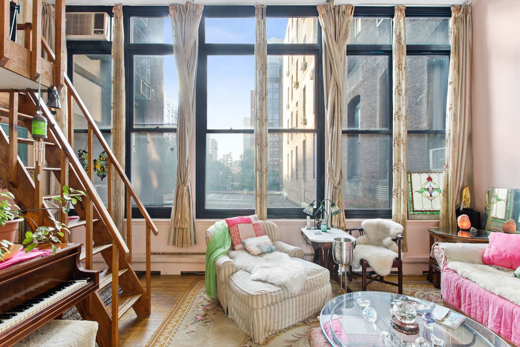 Open the door to stunning ceiling heights, sunny skies, and a gigantic wall of windows in this bright and airy loft in Greenwich Village.