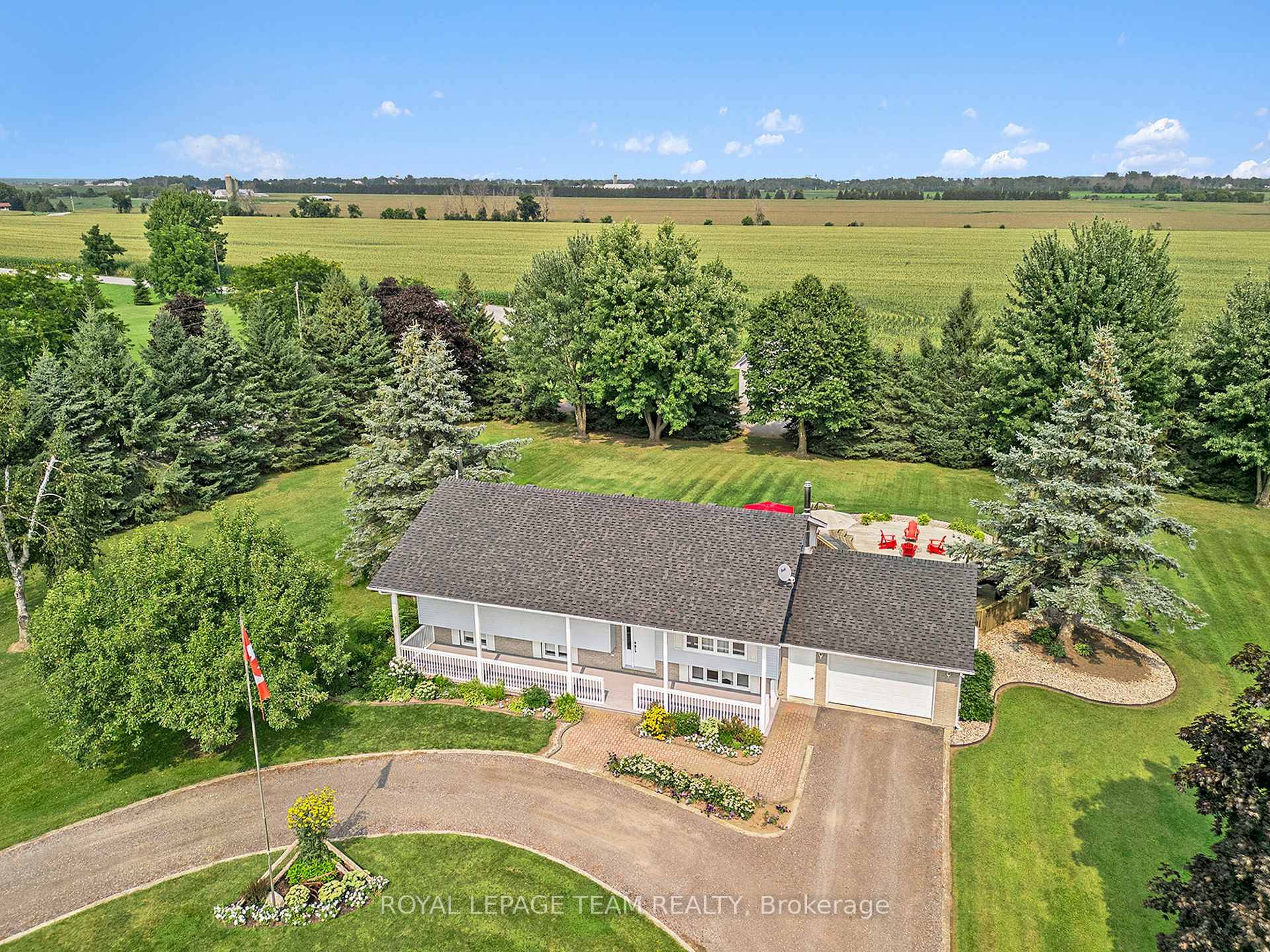 True pride in ownership in this 3 bedroom 2 bath hi ranch bungalow and a detached shop sitting on 12 acres of peace and quiet !