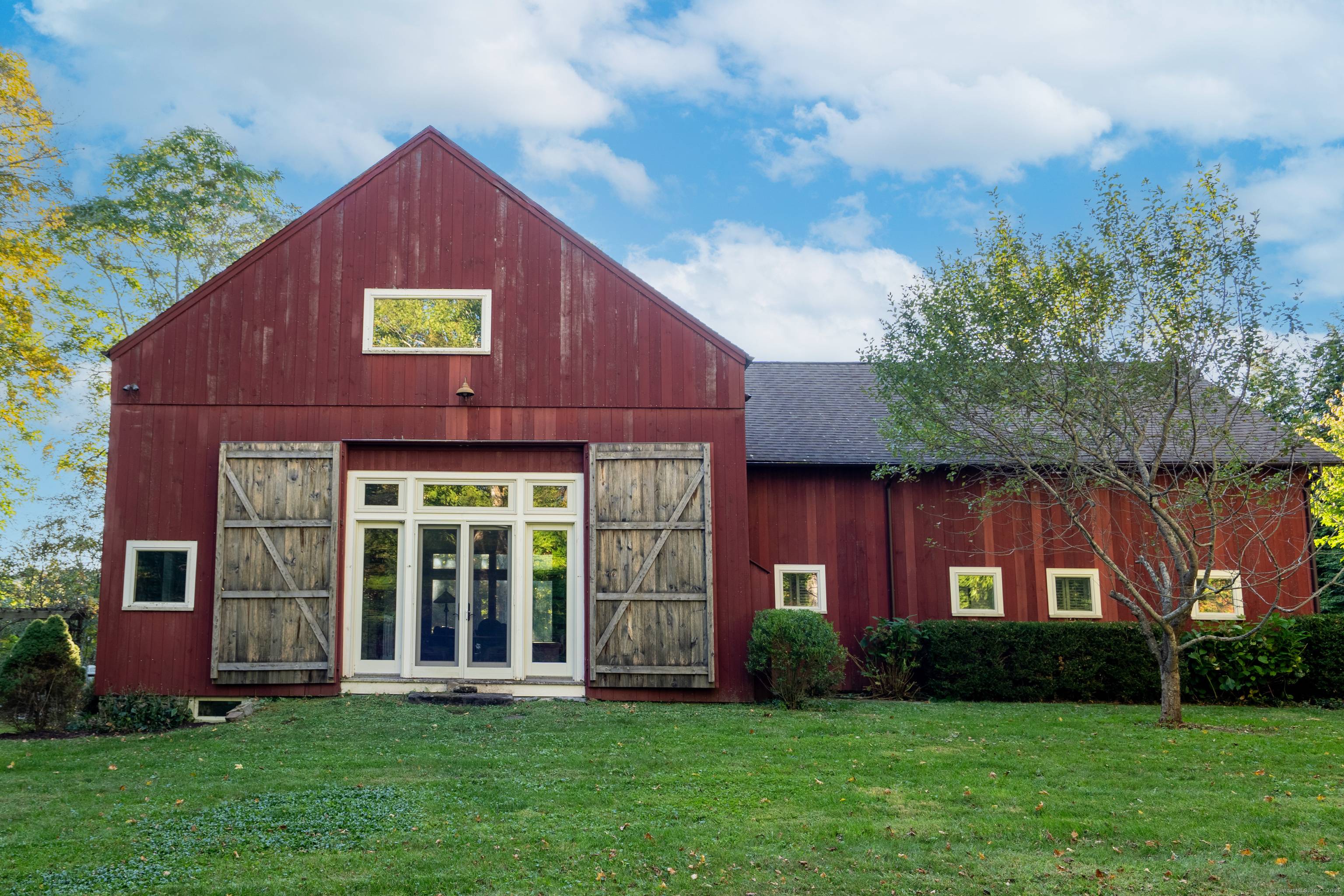 This historic c. 1865 post and beam barn has been meticulously crafted into an incredibly handsome home by master Housewright H.