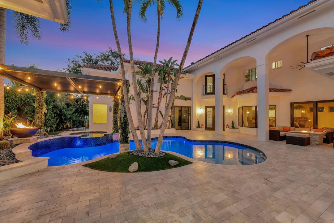 Welcome to unique, one of a kind property with a kasita in the exclusive community of Seasons in Central Boca Raton.