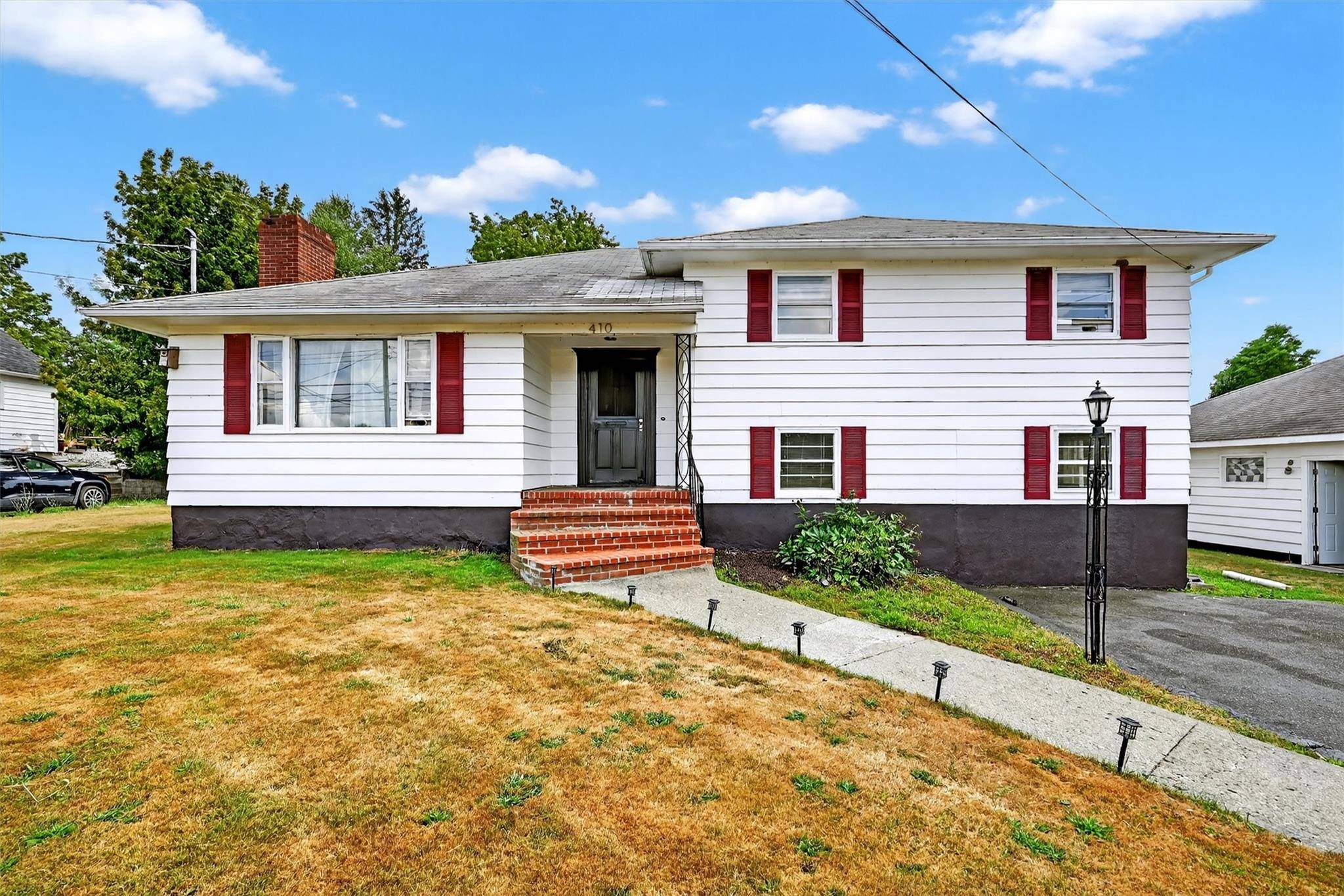 Welcome to this stunning 3 level split style home, nestled on a spacious 1.