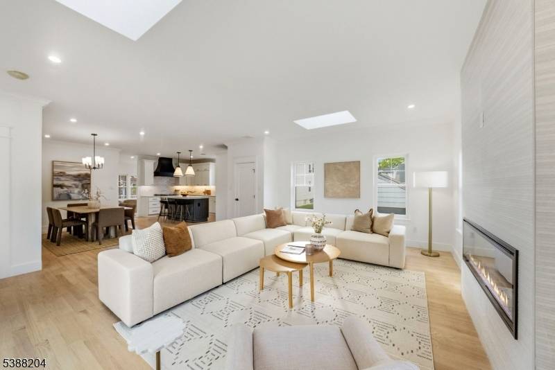 Nestled on a dead end street in the heart of Clark, this stunning custom home offers exceptional craftsmanship, designer finishes, and luxury living across three beautifully finished levels.